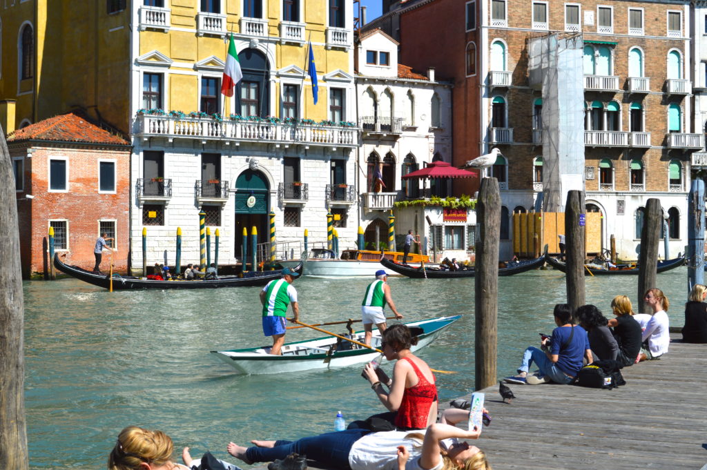 people on a boardwalk in Venice