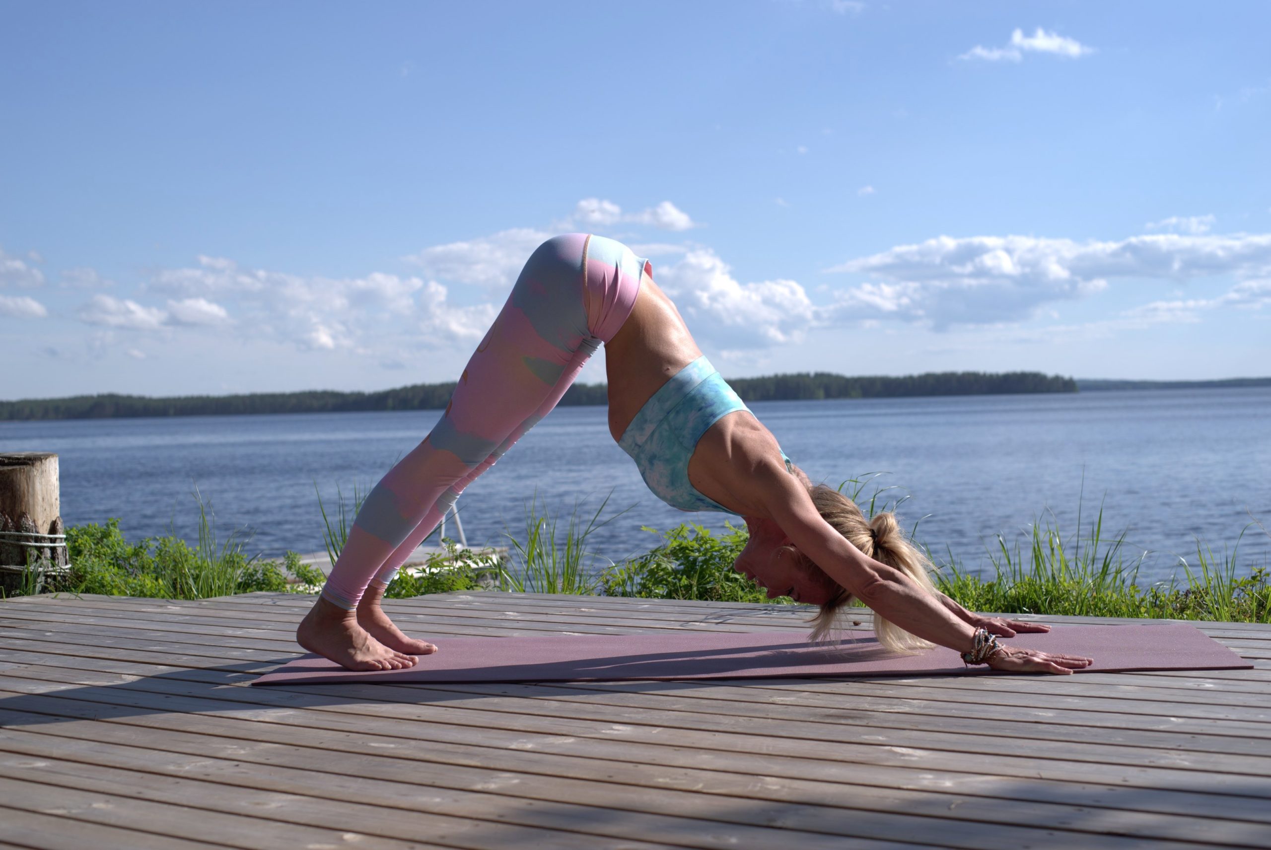 woman in downward facing dog yoga pose
